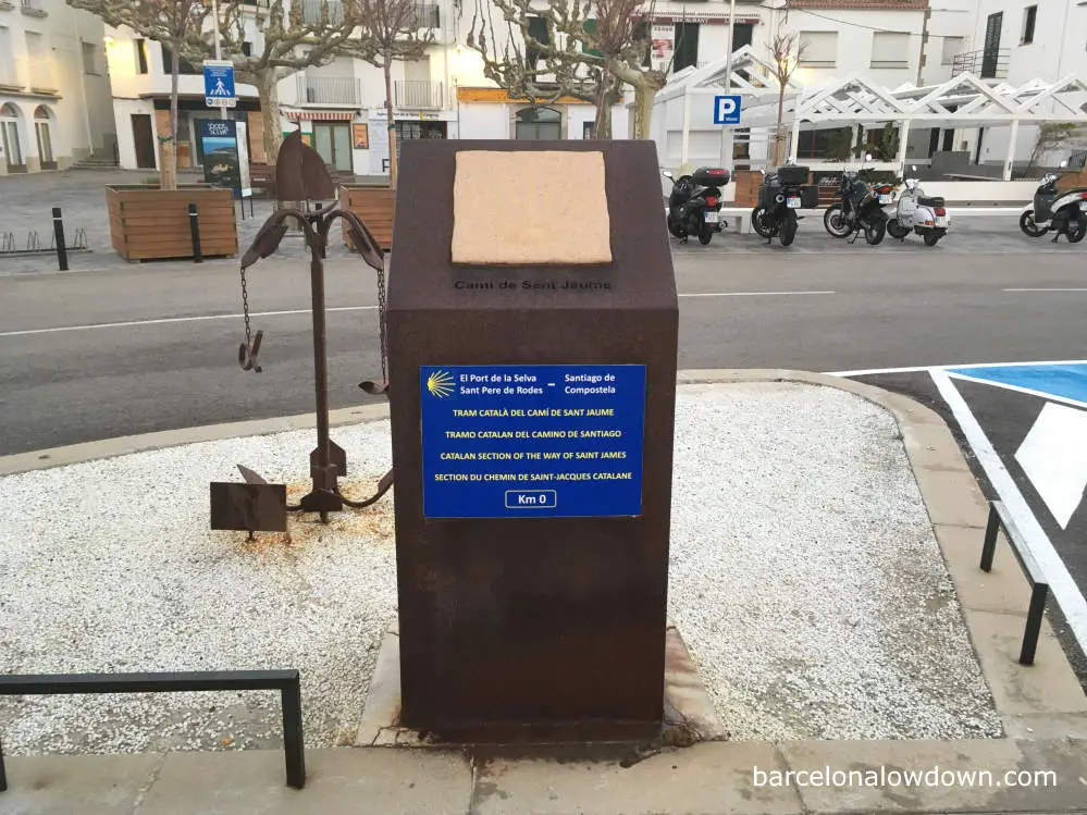 Metal sign indicating the official starting point of the Camino de Santiago in El Port de la Selva, Spain