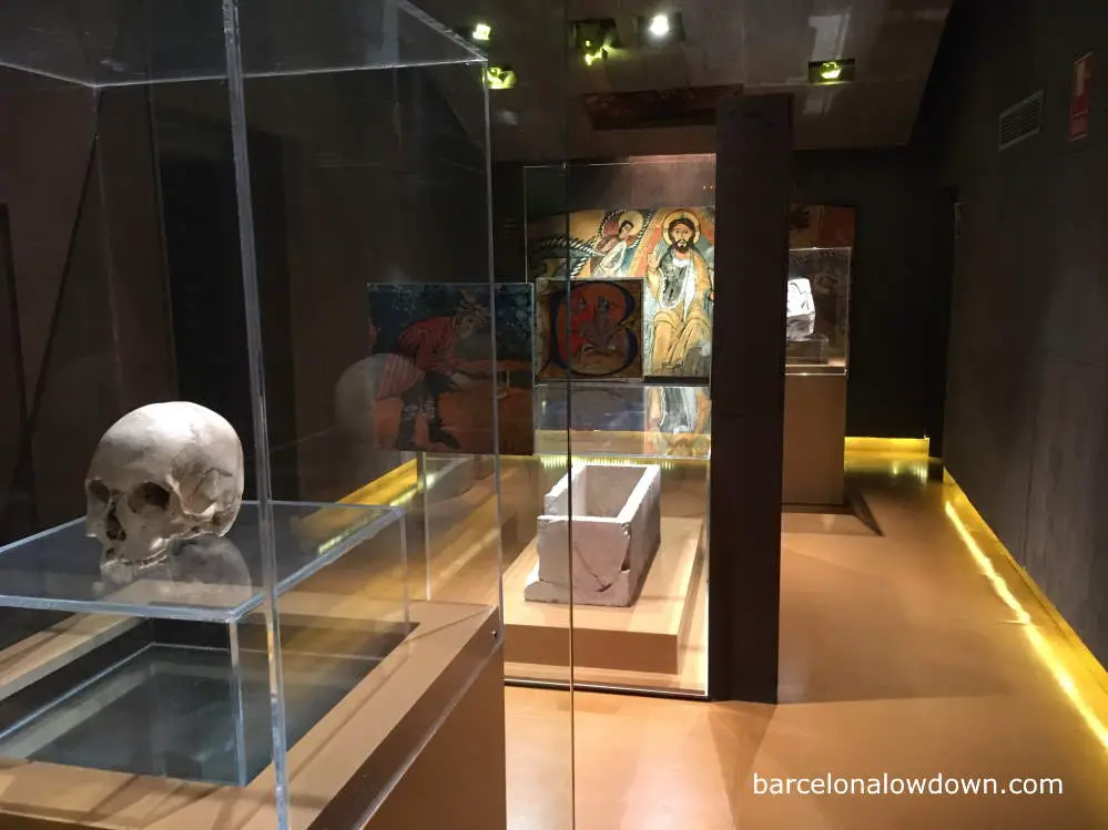 A skull and some paintings in a museum in Peralada