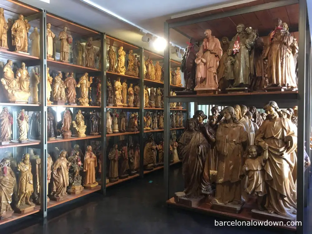 Clay statues of saints on shelves in the Santes museum, Olot, Spain