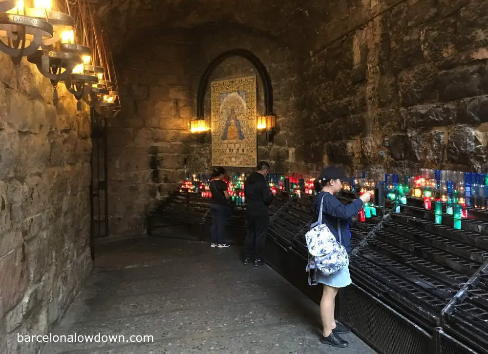 Pilgrims lighting candles at the Basilica of Montserrat, Spain