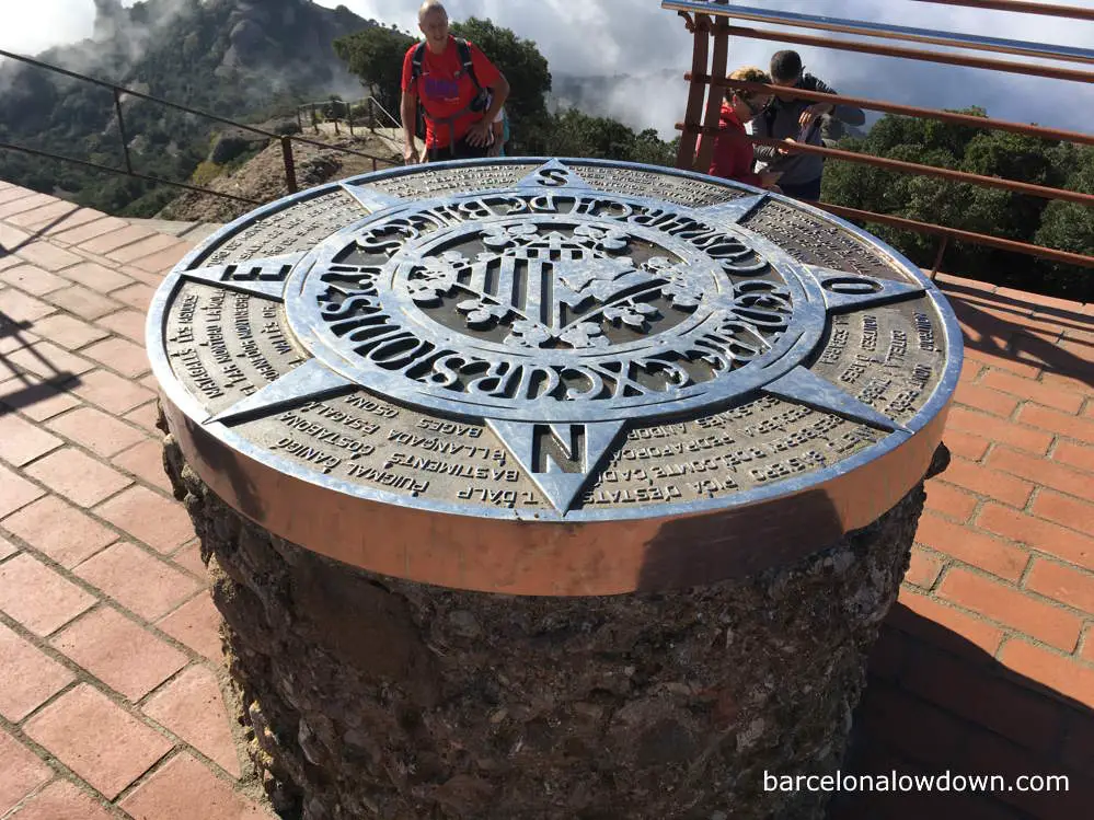A sign which marks the highest point on Montserrat mountain in Spain