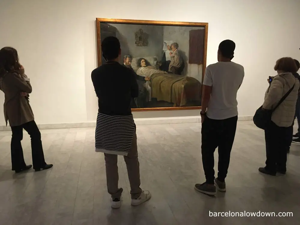 Five people admiring Science and Charity in the Picasso Museum Barcelona