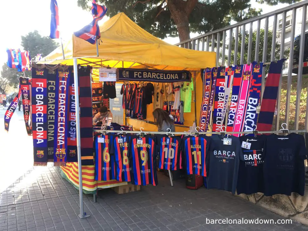 An unofficial merchandising stall selling FC Barcelona shirts and scarves