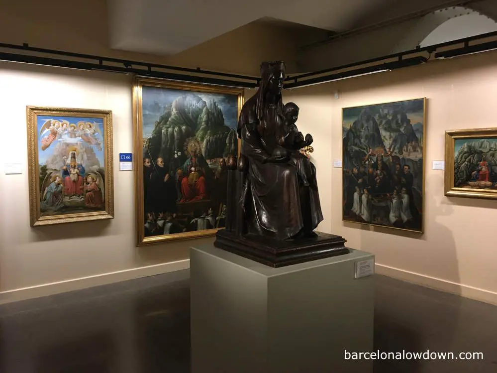 Paintings and a statue of Nuestra Señora de Montserrat in the Montserrat Museum