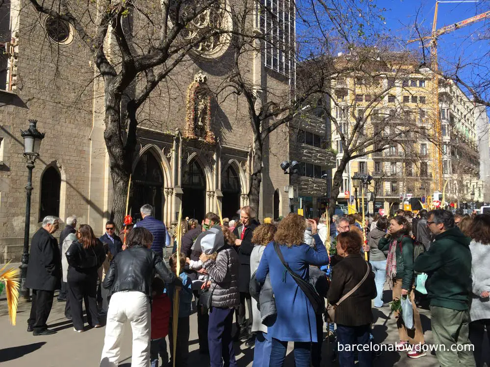 A congregation getting their palms blessed on Palm Sunday in Barcelona