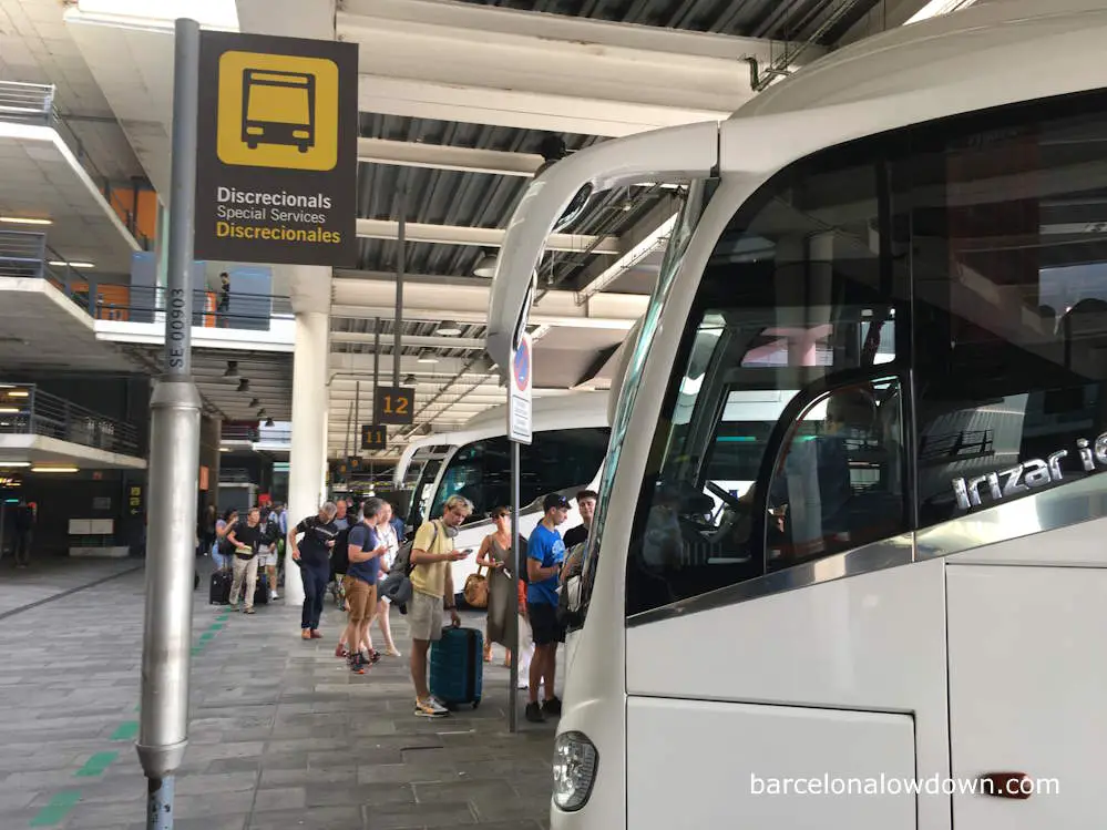 Tourists boarding a bus to the Costa Brava