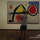 A man looking at a painting in the Fundació Joan Miró art museum, Barcelona