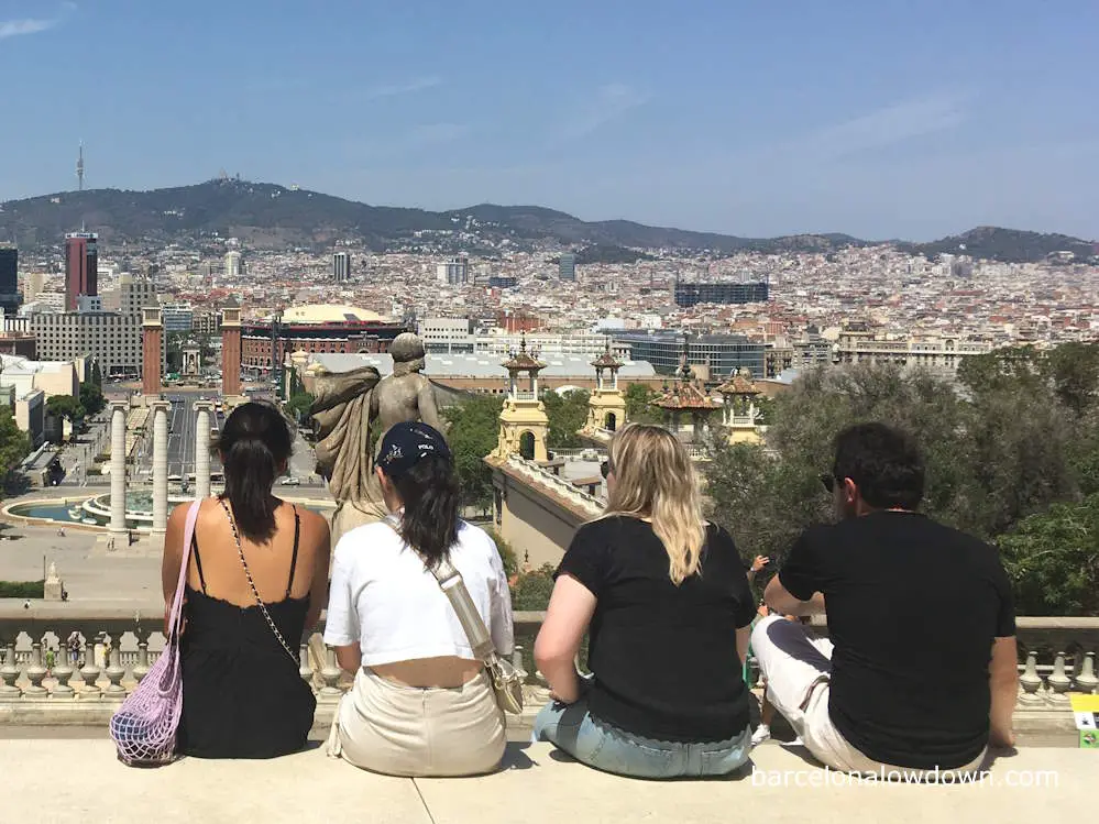 A group of friends enjoying the views from the terrace of the MNAC museum in Barcelona
