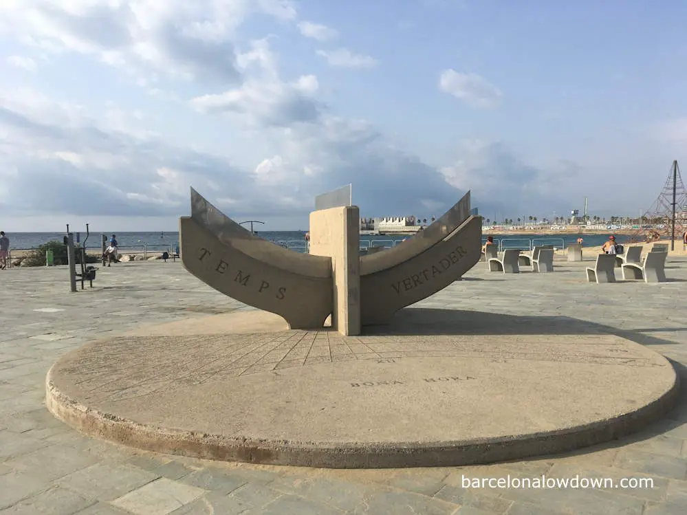 A concrete sundial on Barcelona's waterfront promenade